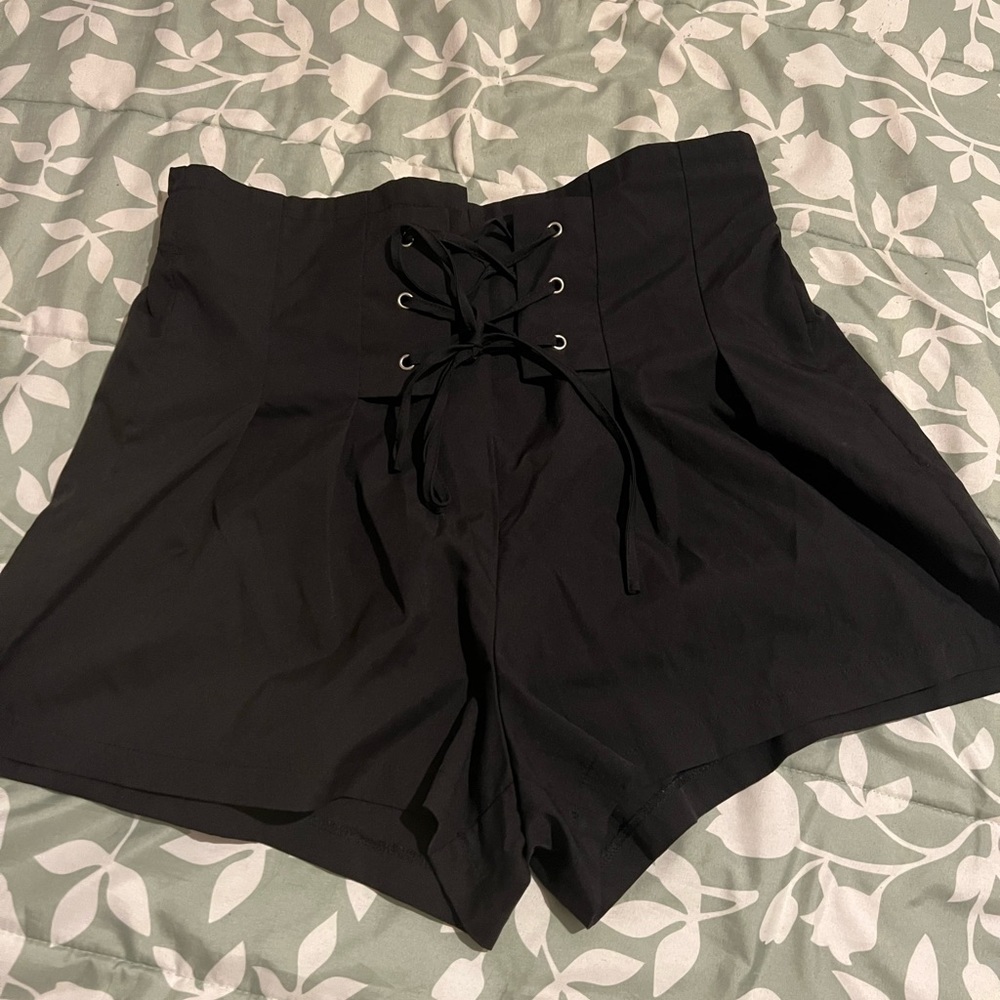 High waisted black shorts with crisscross tie detail